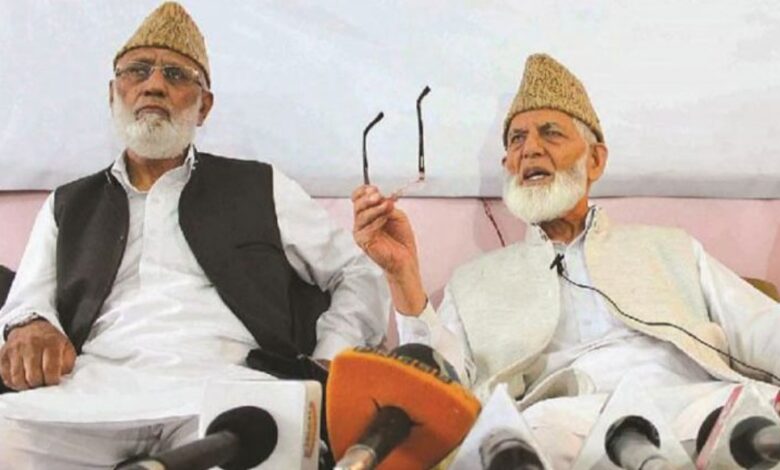 (File) Mohammad Ashraf Sehrai (left) with Syed Ali Geelani during a press conference